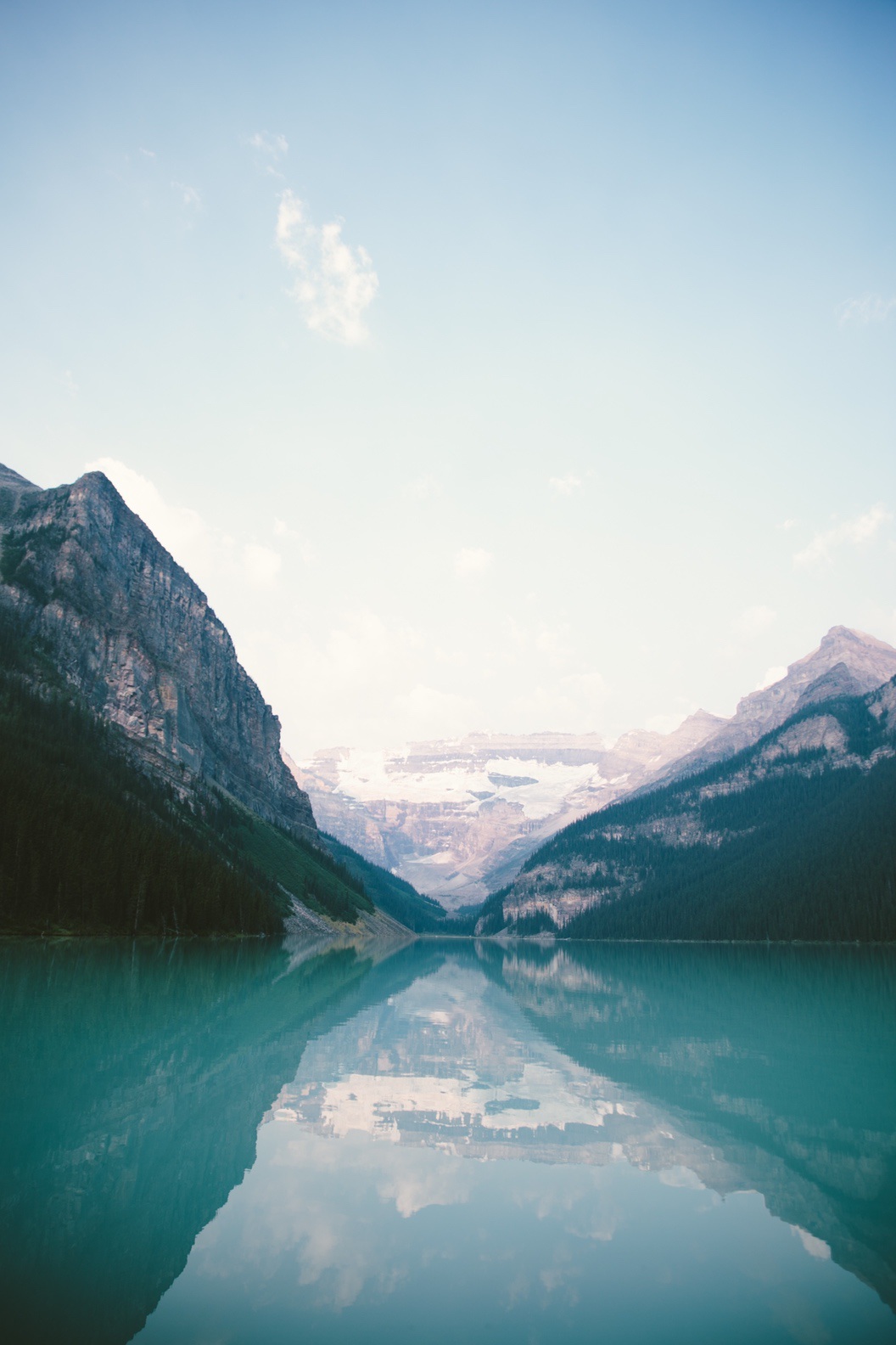 Blue water wallpaper with mountains