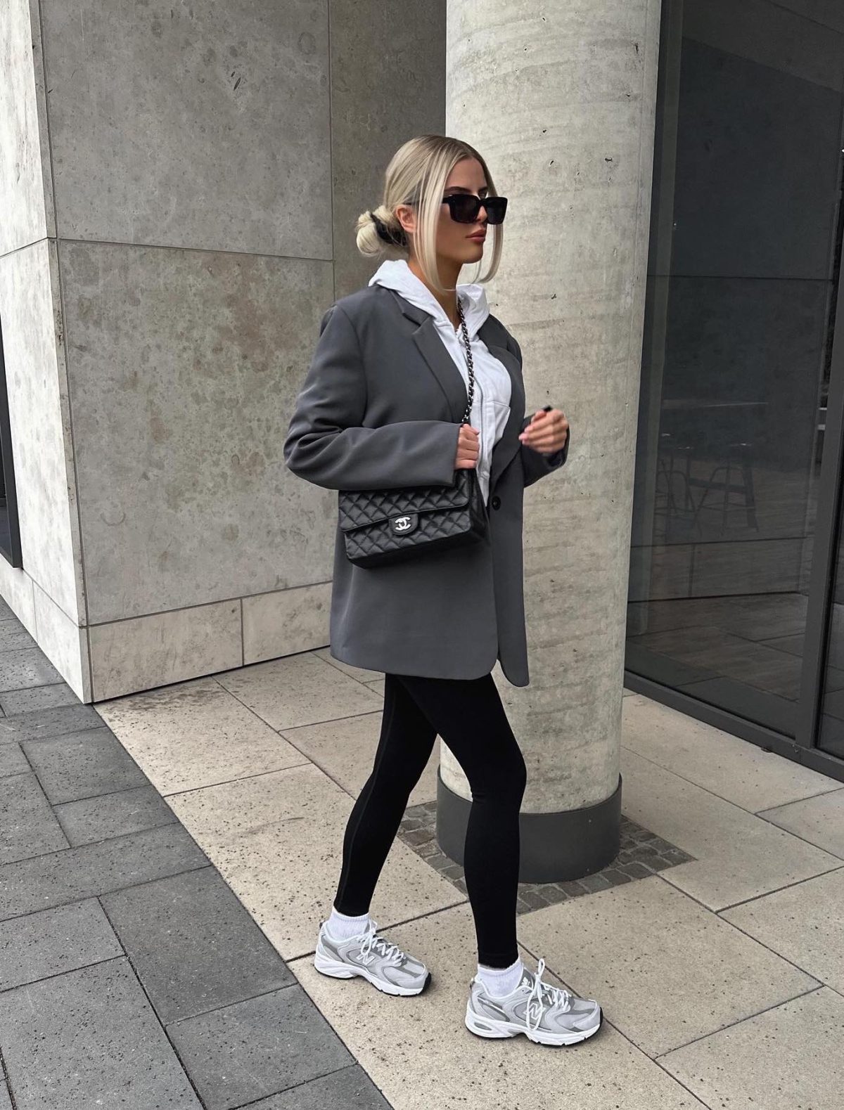 Cute sporty chic outfit with black leggings and grey blazer.