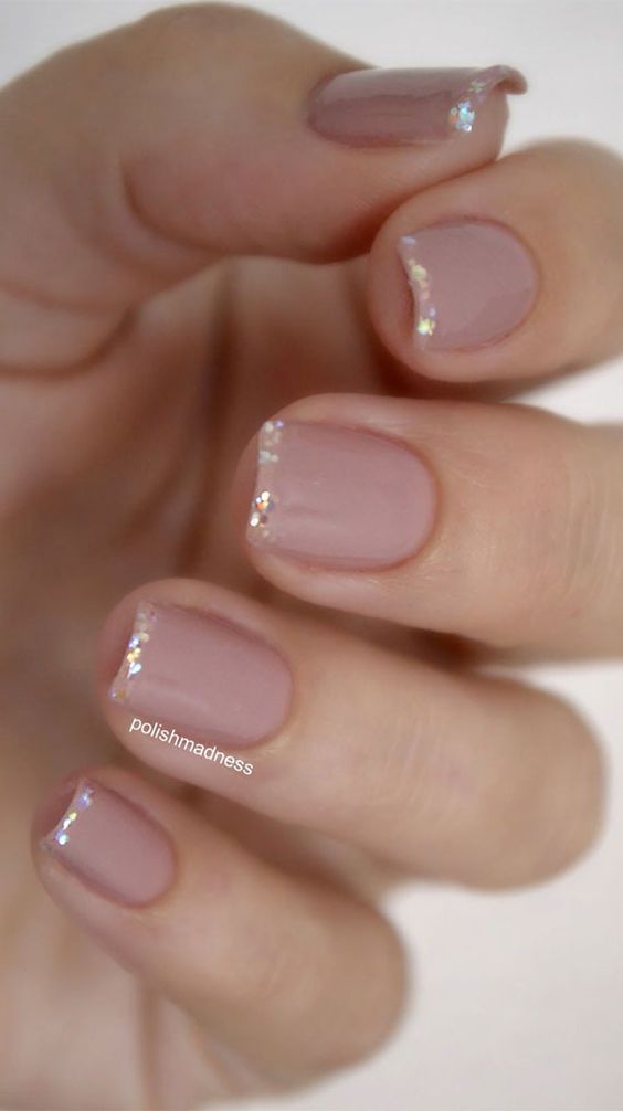 Short French tip nails with glitter