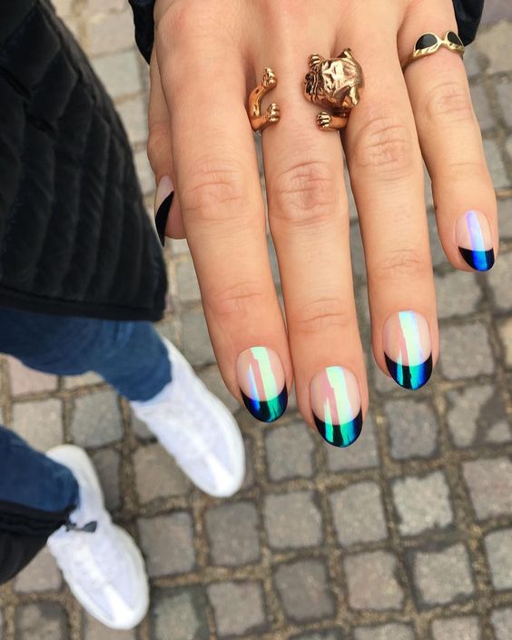 Holographic black short French tip nails.