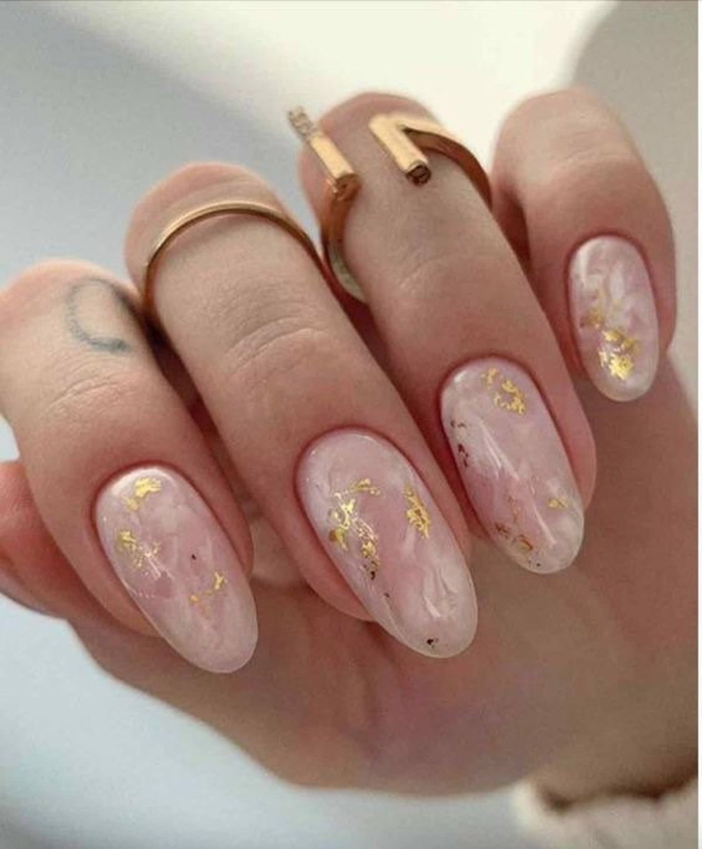 Pretty white marble nails with gold foil for brides
