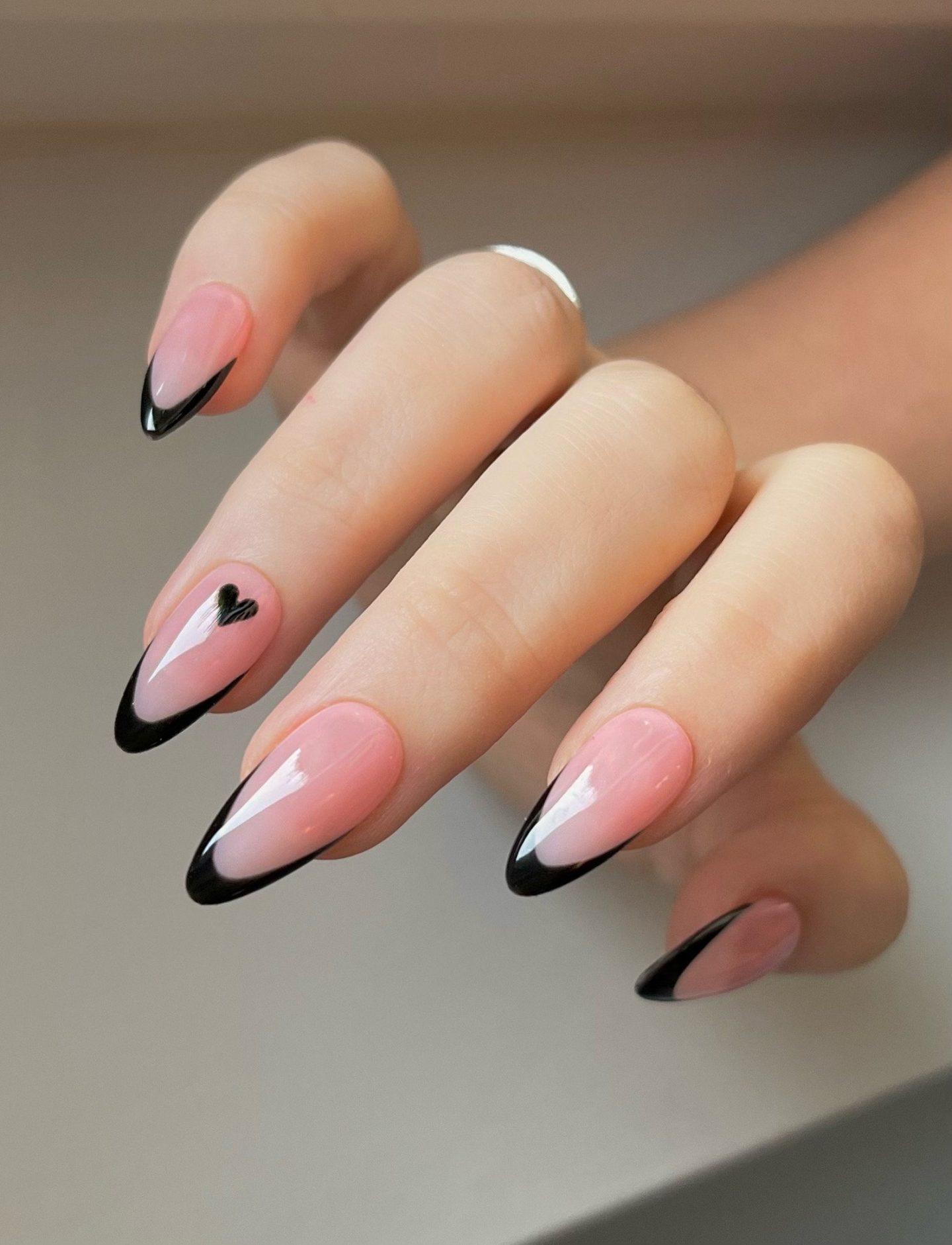 Cute black minimalist French tip nails in almond shape