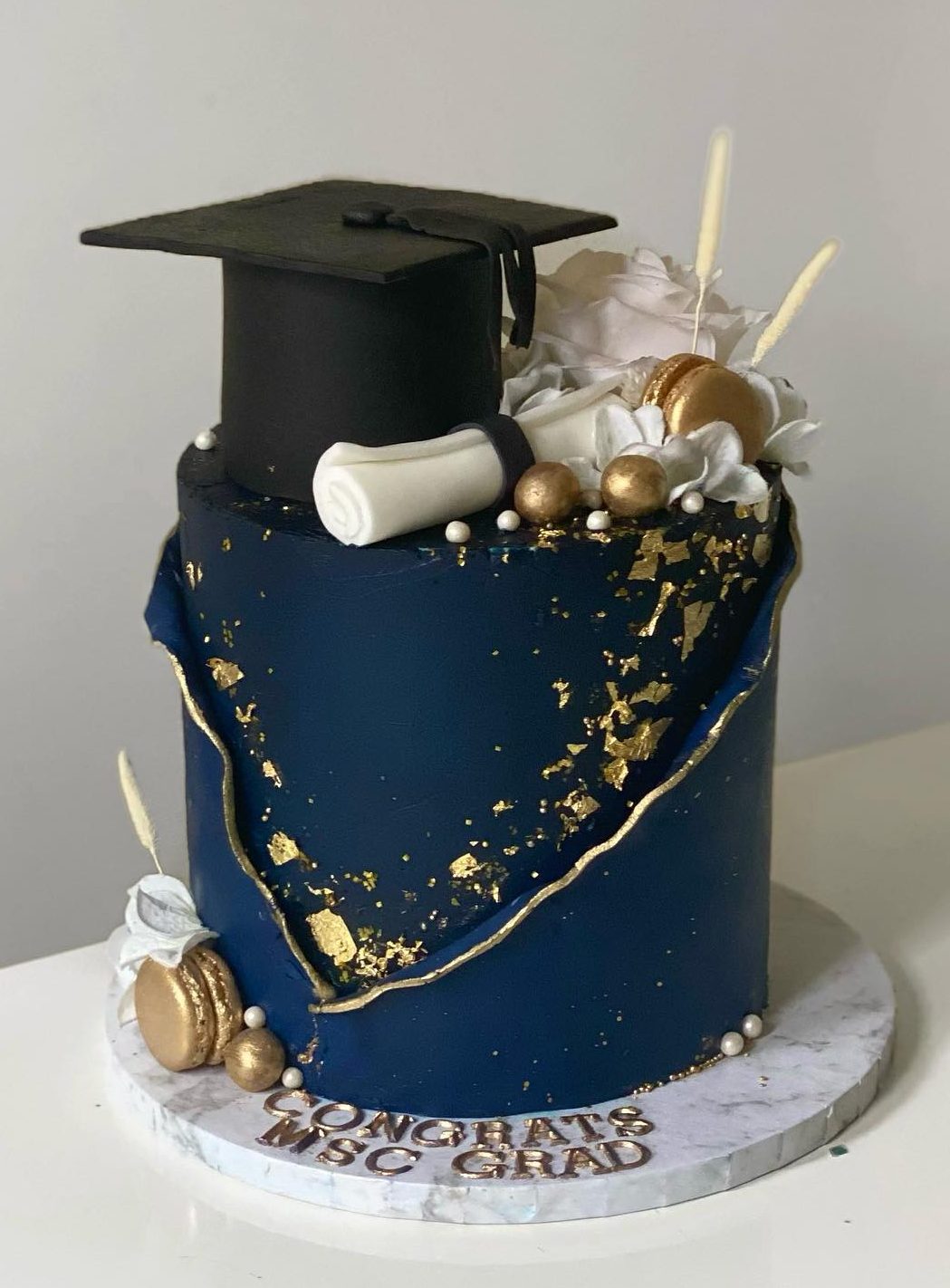 Blue grad cake with cap
