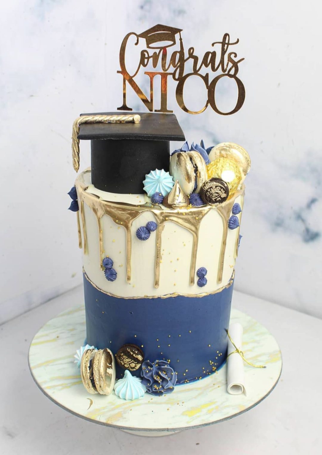 Elegant grad cake with blue and white