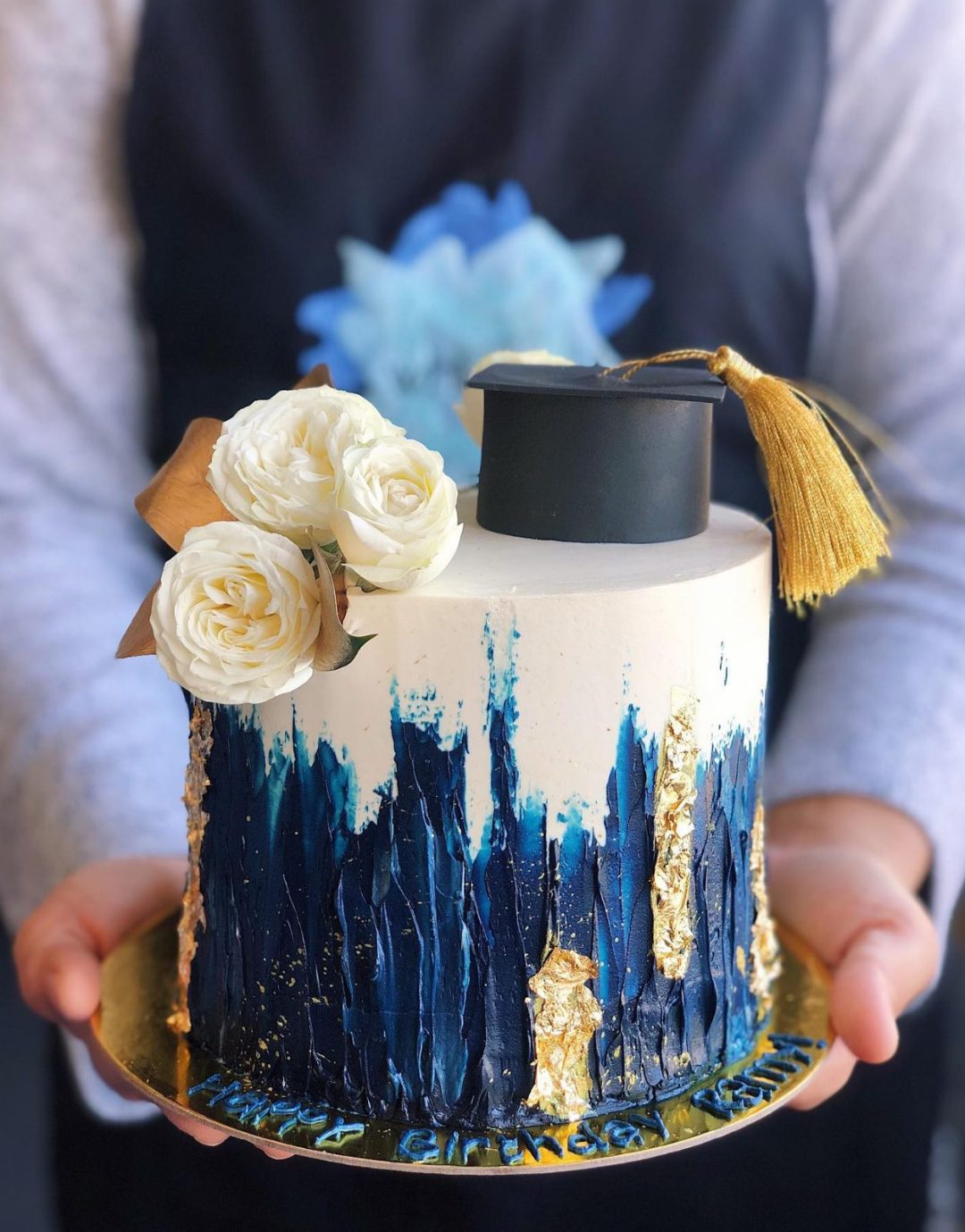 Elegant white, blue and gold grad cake