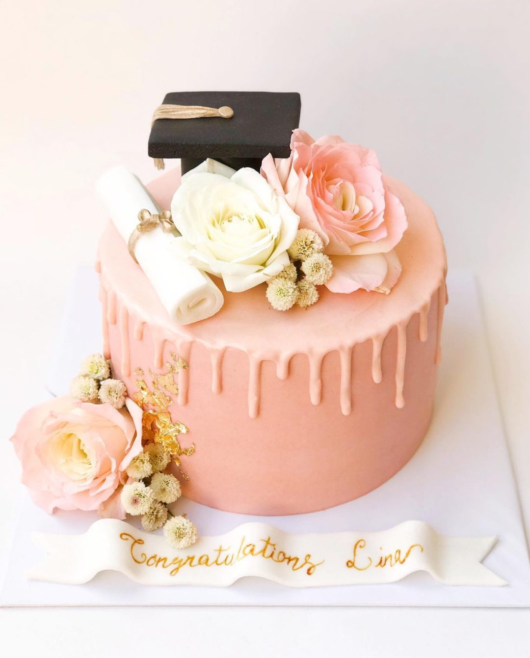 Elegant pink graduation cake