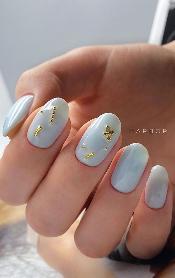 Cute short pastel blue nails.