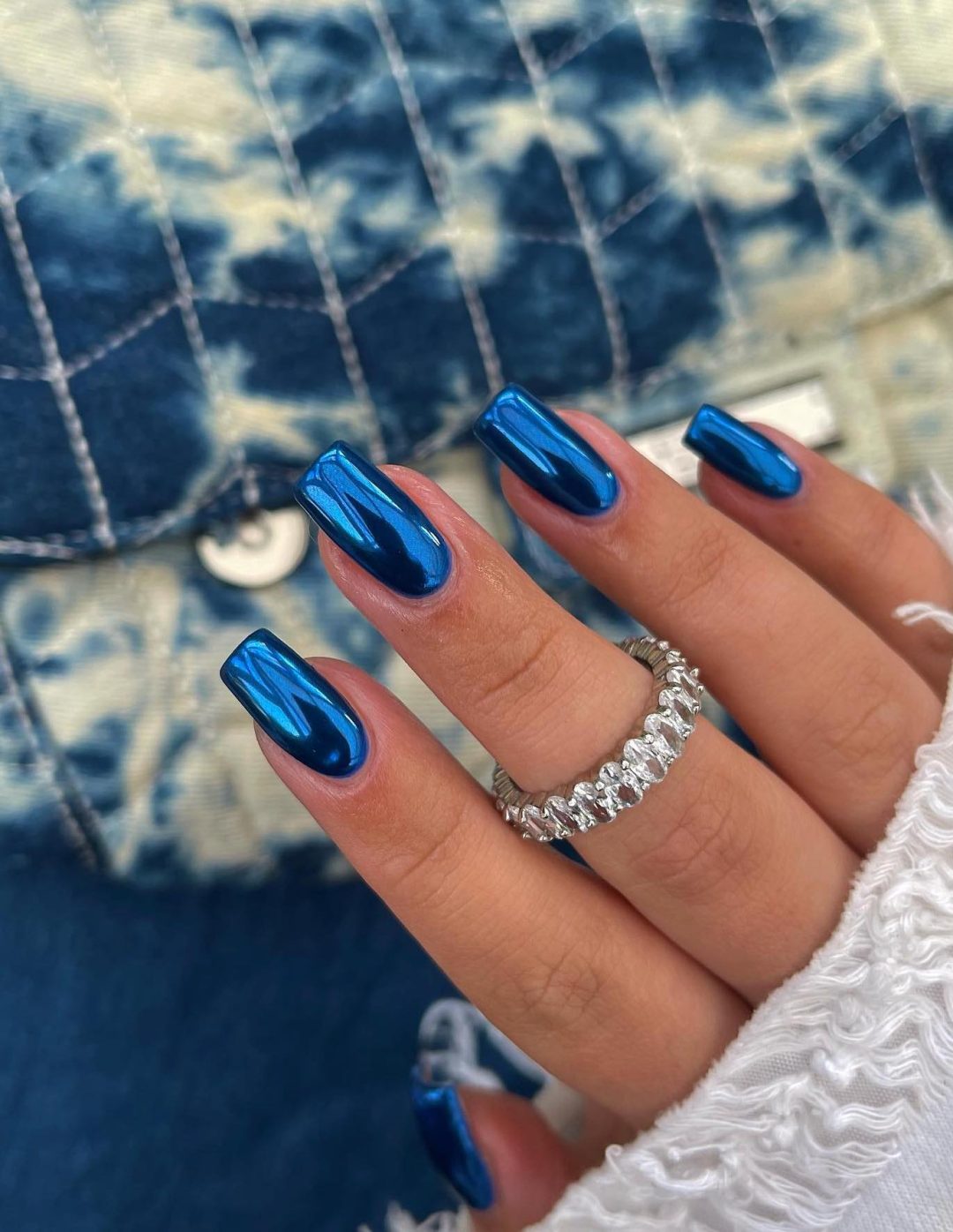 Royal blue chrome nails.