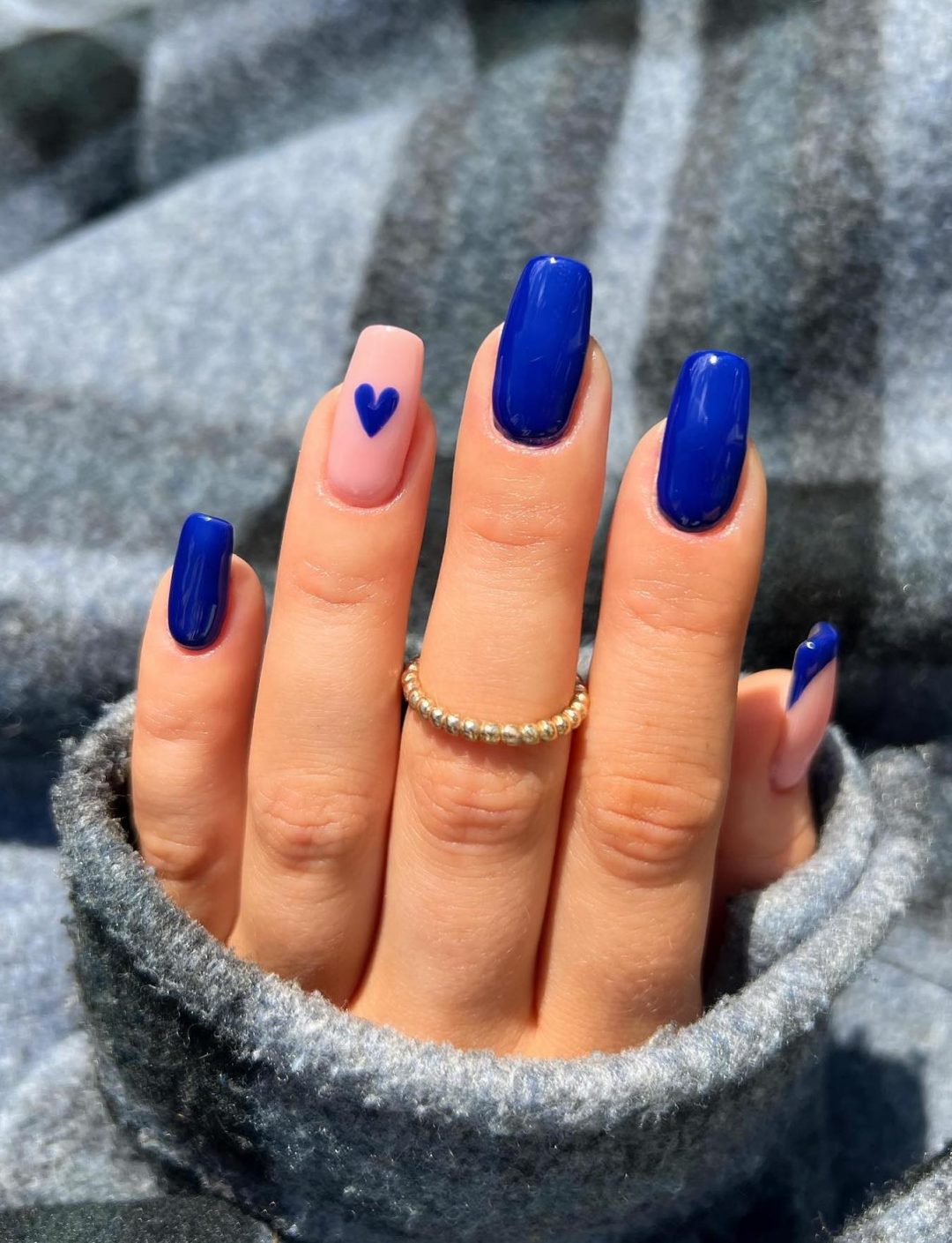 Cobalt blue nails with a heart.