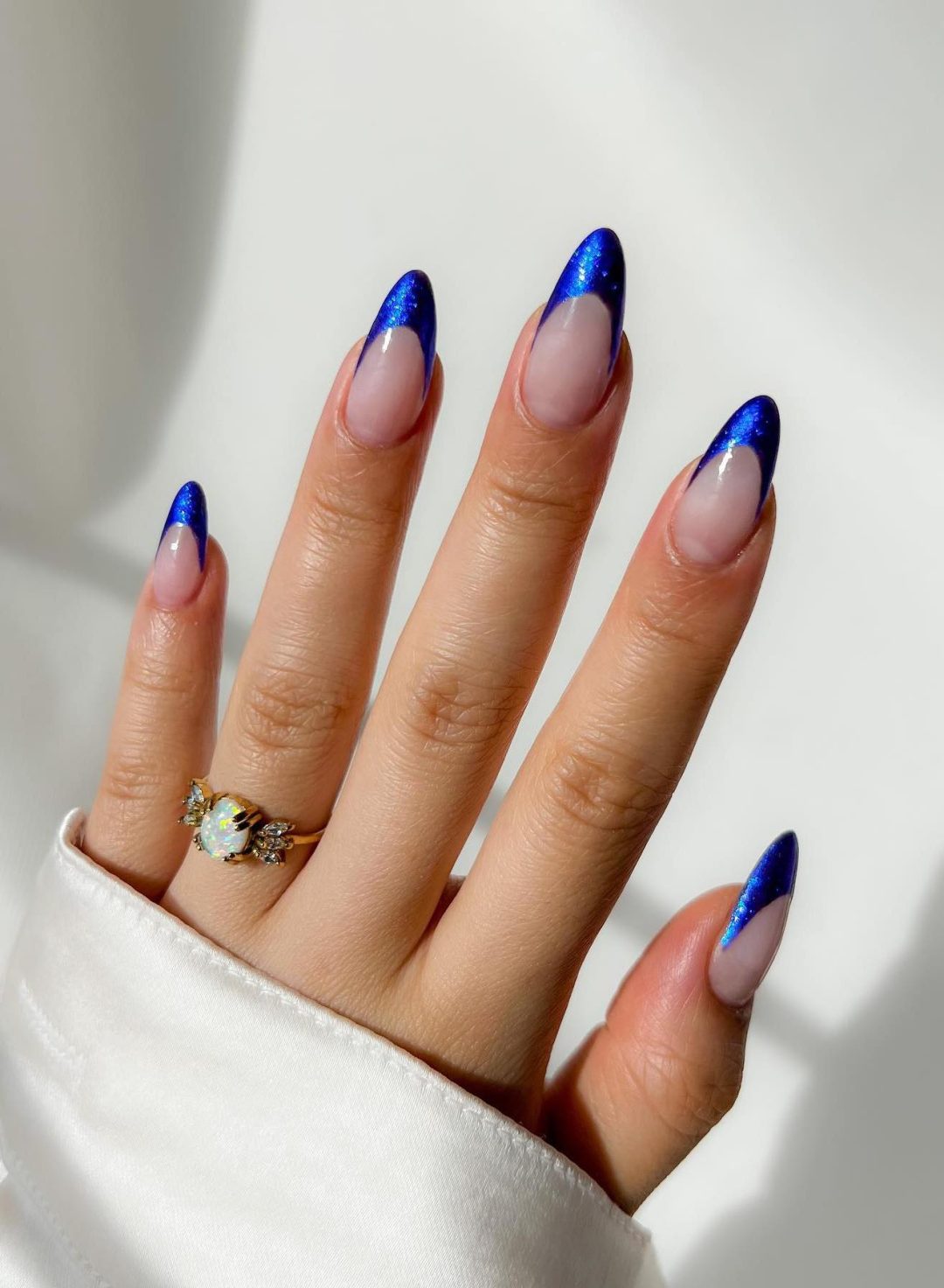 Royal blue French tip nails.