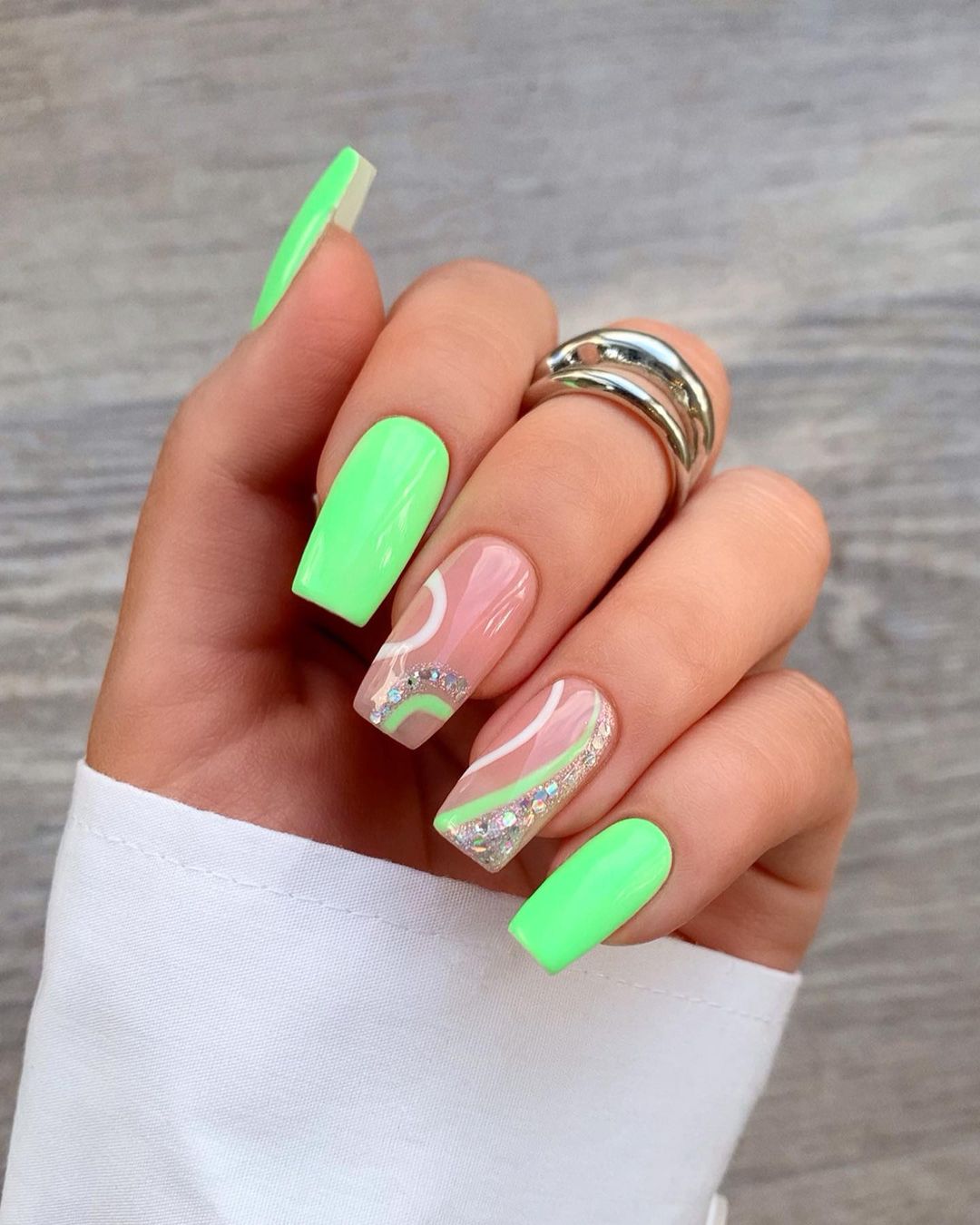 Cute lime green neon nails with swirls