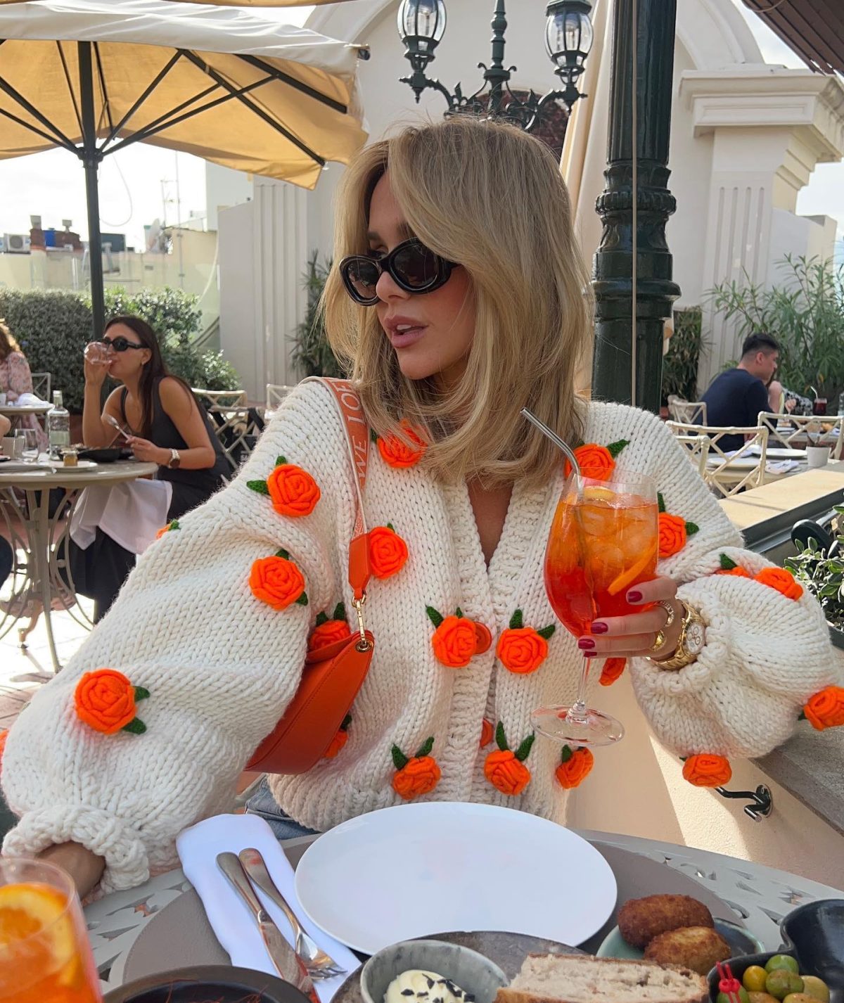 Cute orange rose cardigan for spring.