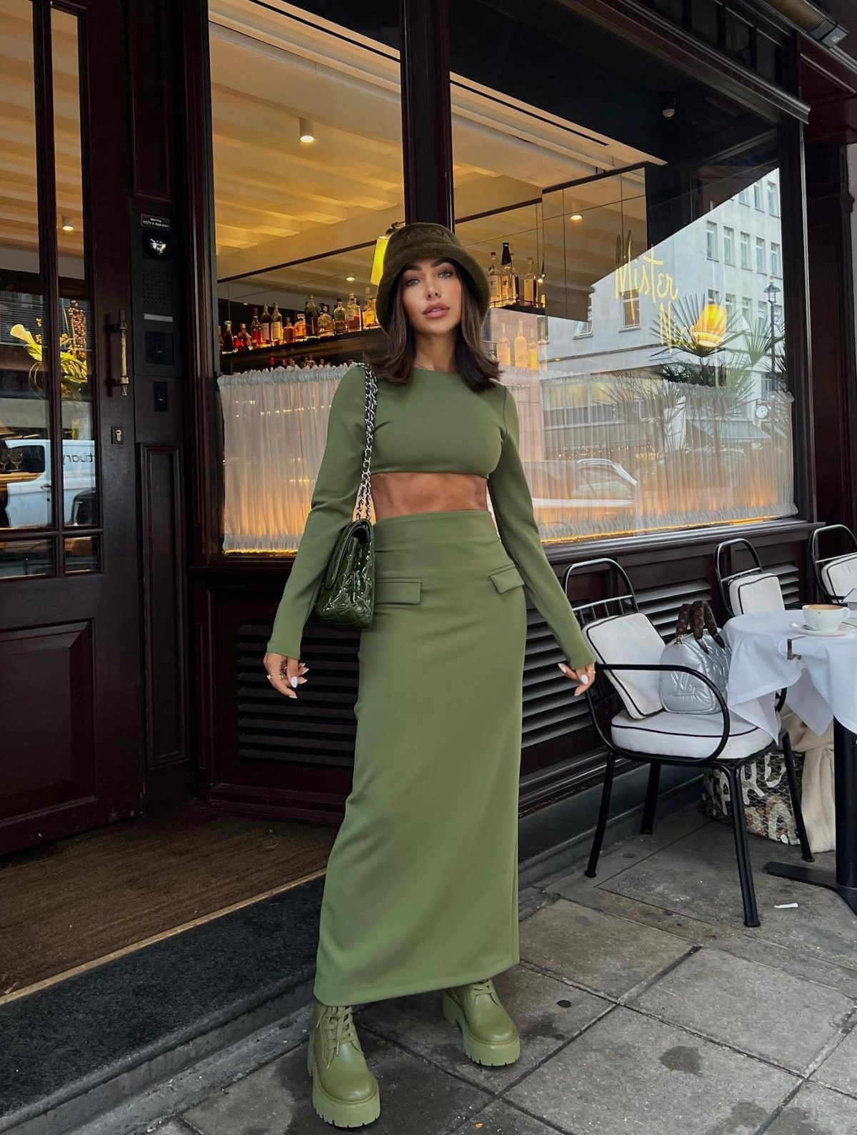 Olive green outfit with maxi skirt and olive combat boots.