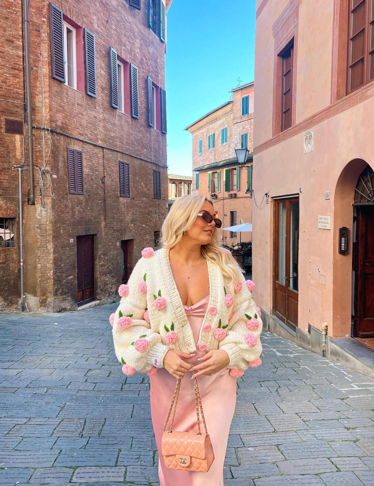 Cute Easter outfit with a pink satin dress and a cute pink rose cardigan.