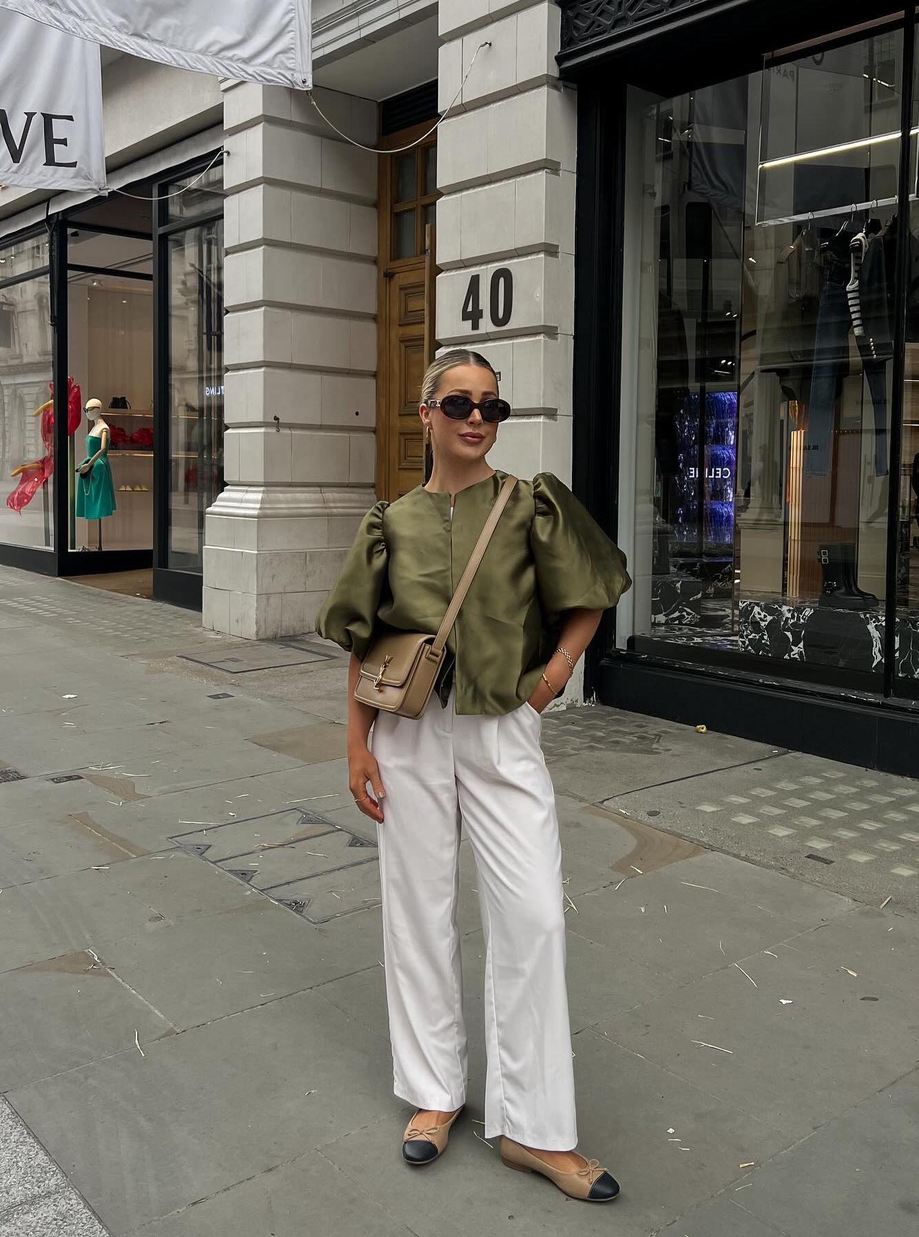 Chic spring outfit with beige pants and an olive green top.