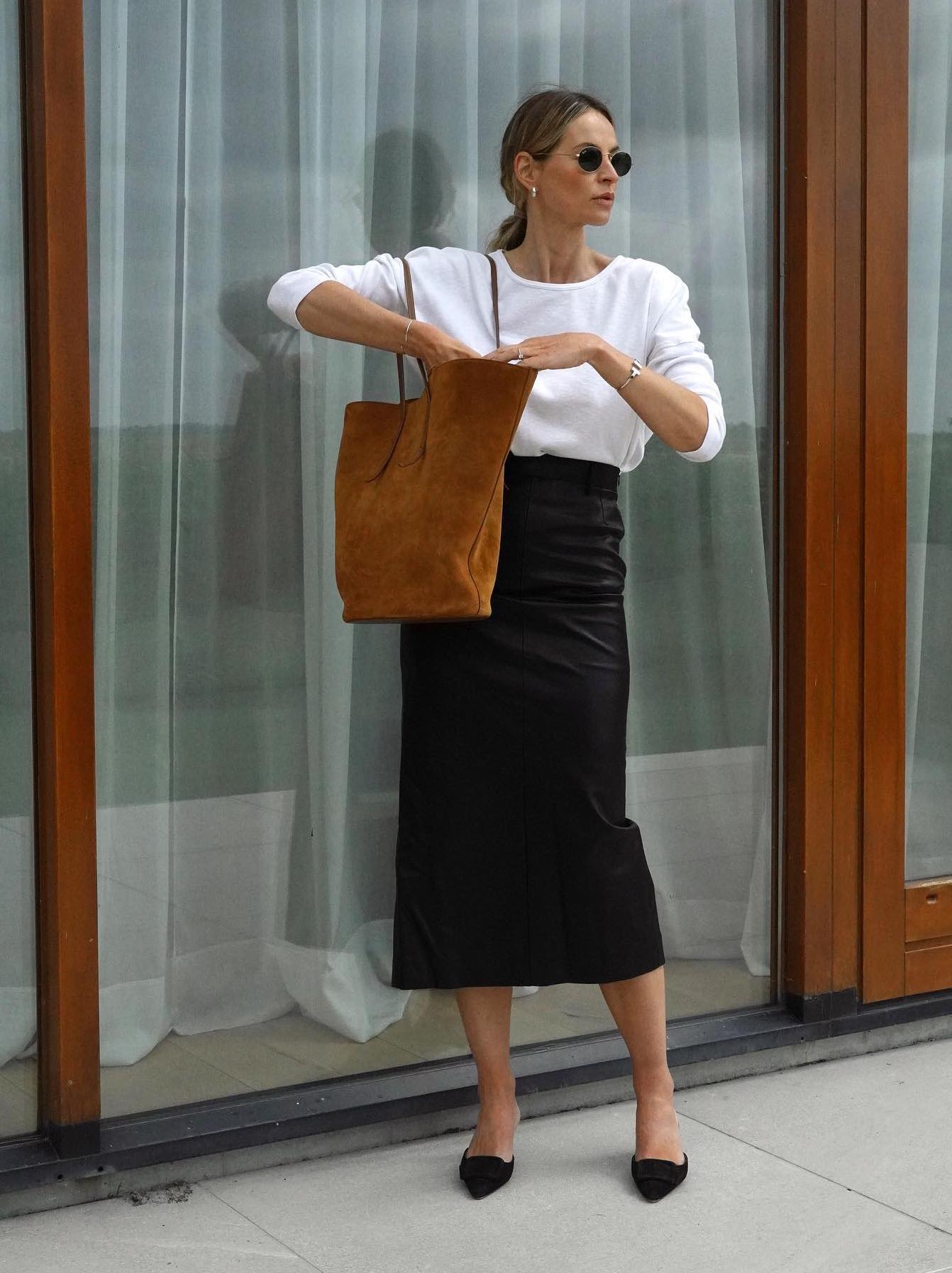 Business casual outfit with a long black leather skirt