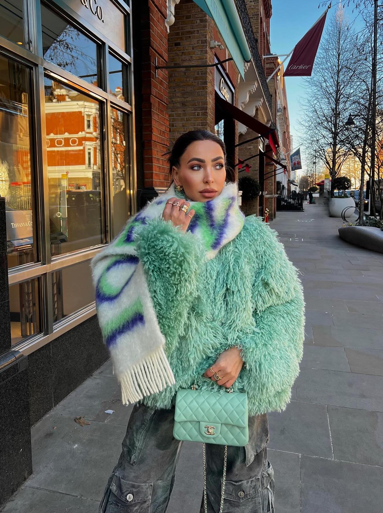 Cute camo pants outfit with a mint green jacket and Loewe scarf.