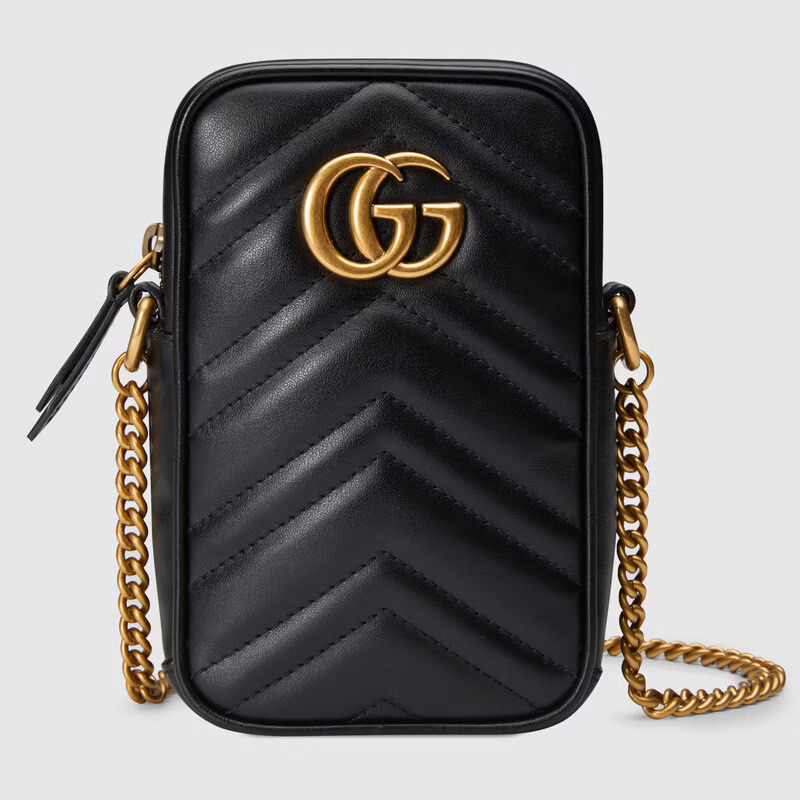 Best designer phone bag: Black and gold Gucci GG Marmont mini bag 