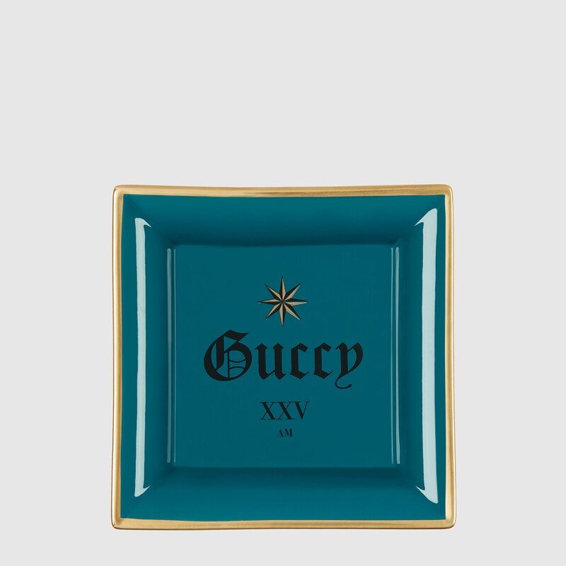 Teal, gold, and black Gucci Change tray with 'Guccy' print 