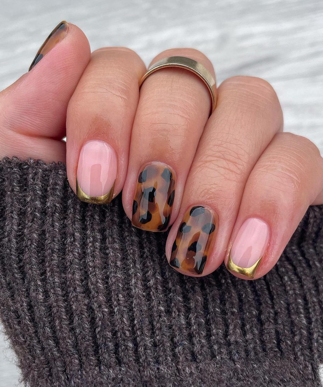 Tortoiseshell nails with clear base and gold tips
