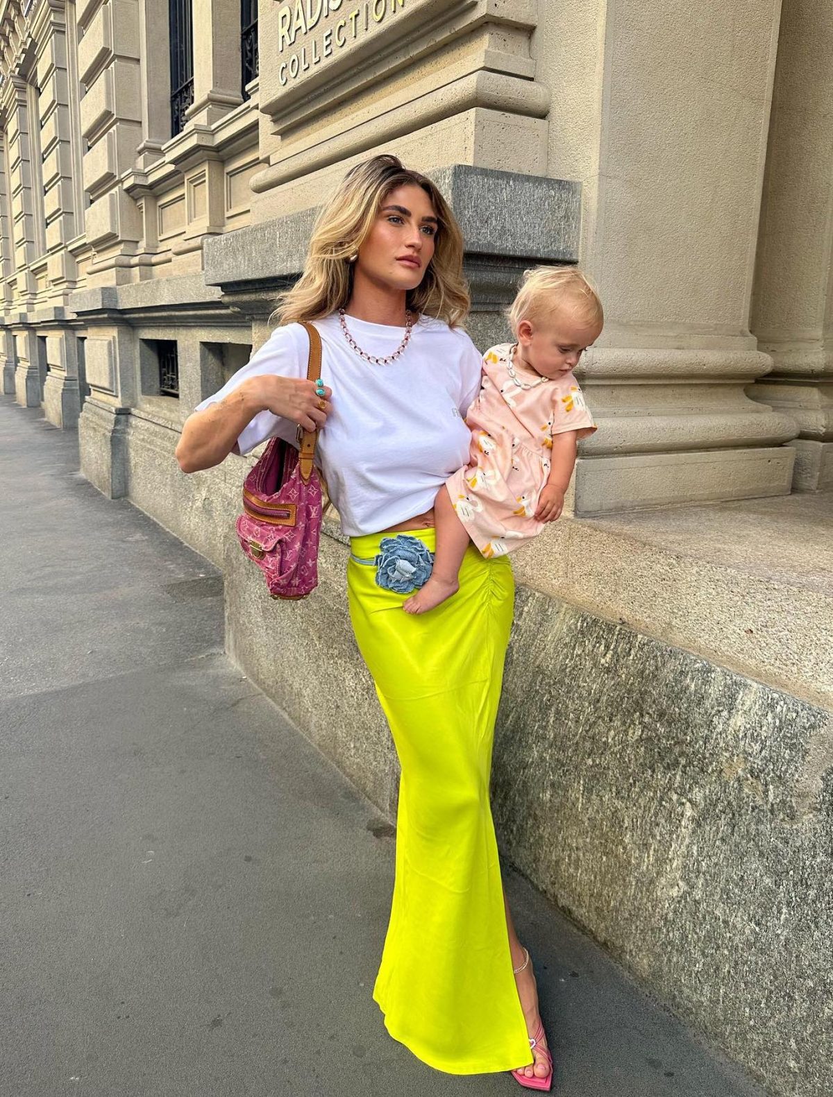 Long yellow satin skirt with a white tee.