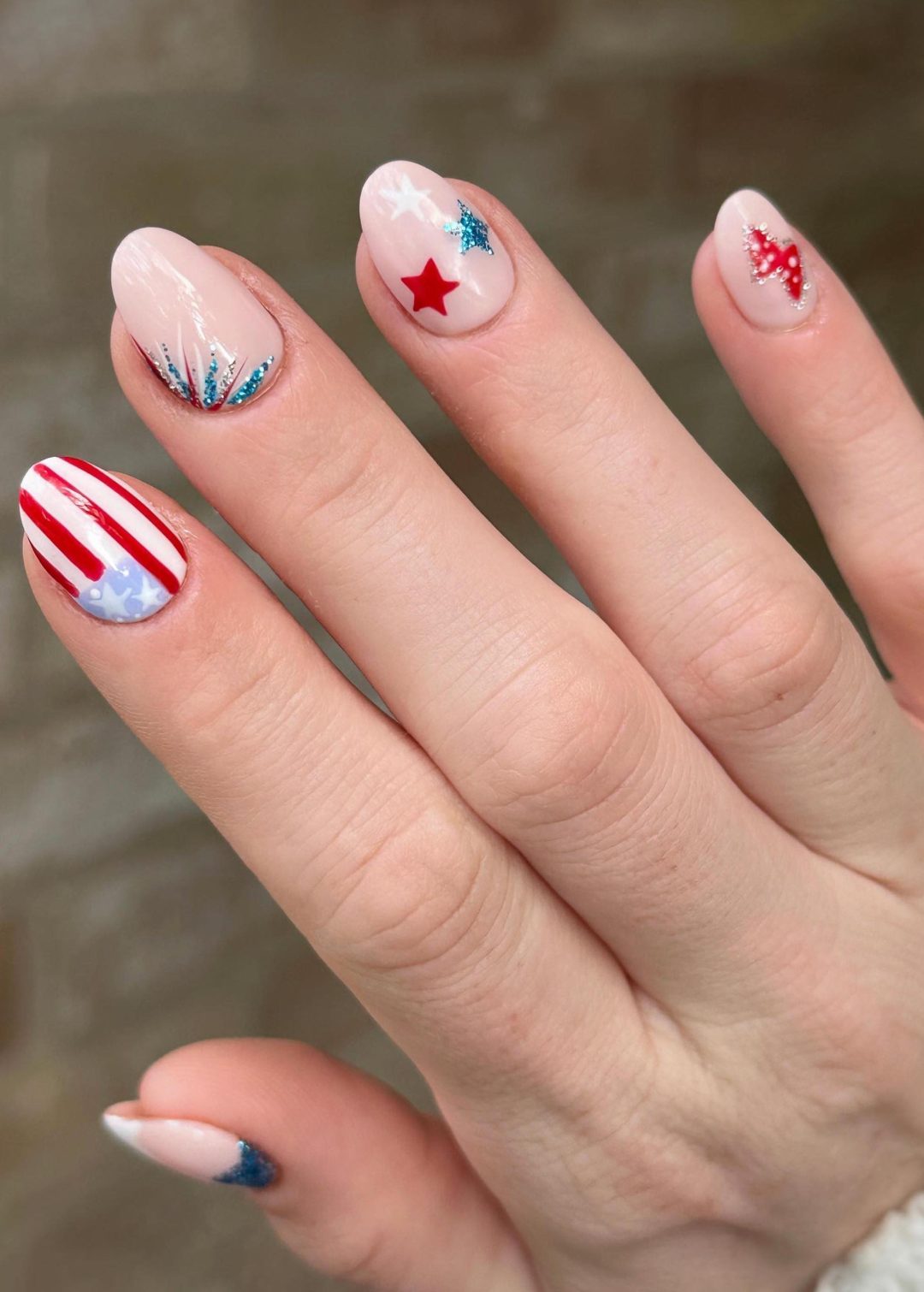 Clear base nails with 4th of July decorations.