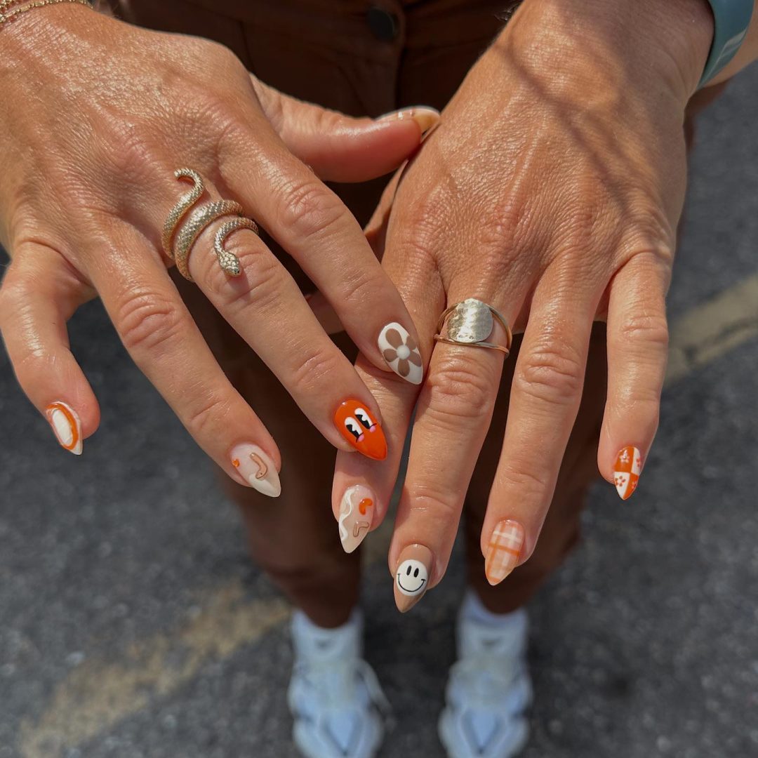 Cute mix and match fall nails wit smiley face nail art