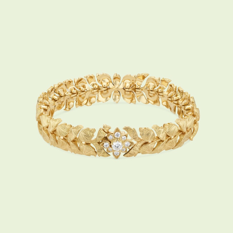 Yellow gold Gucci Flora 18k wide bracelet with Double G 