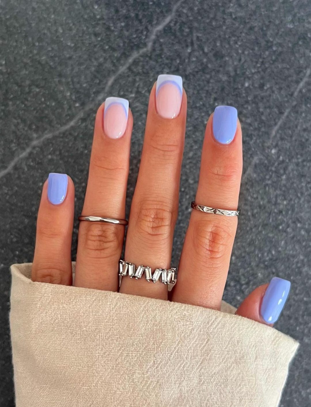 Short light blue French tip nails.