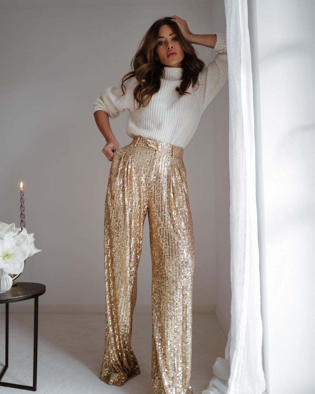 Gold sequin pants outfit with white sweater