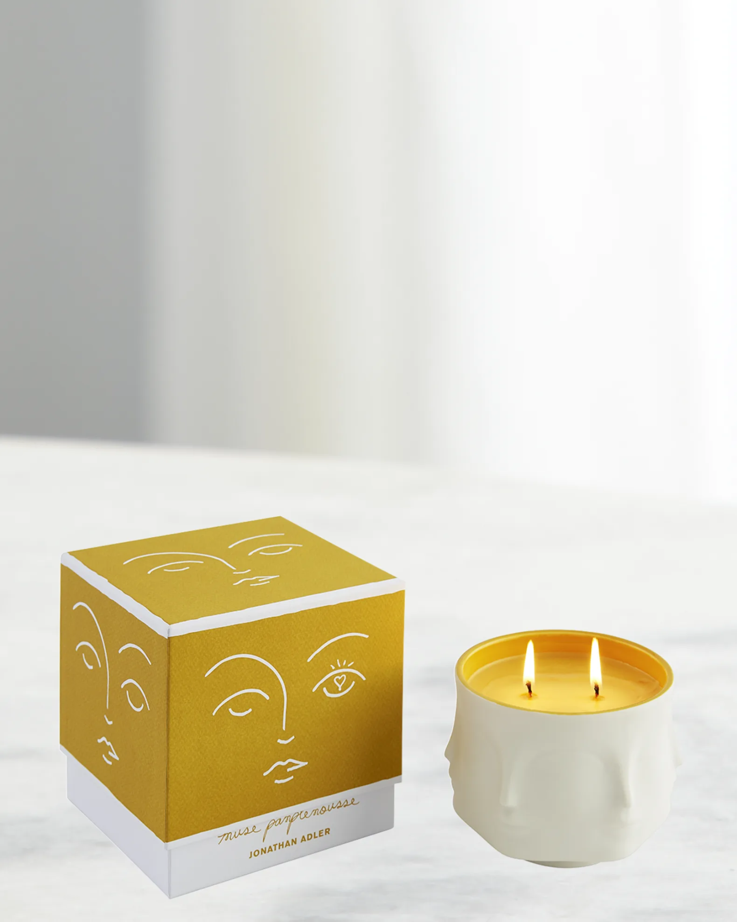 White and yellow Jonathon Adler Muse Candle 