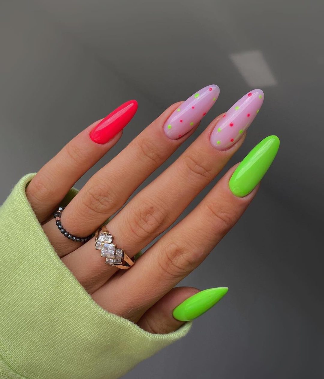 Neon green and bright red summer nails with watermelon effect.