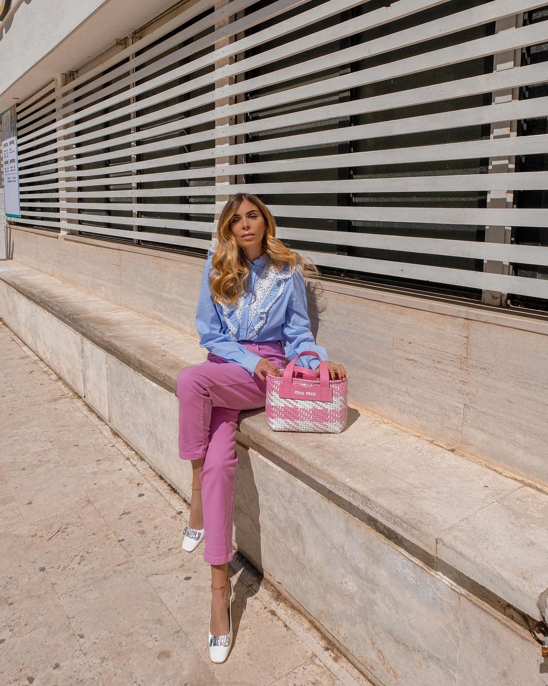 Chic business casual outfit with pink pants and blue shirt