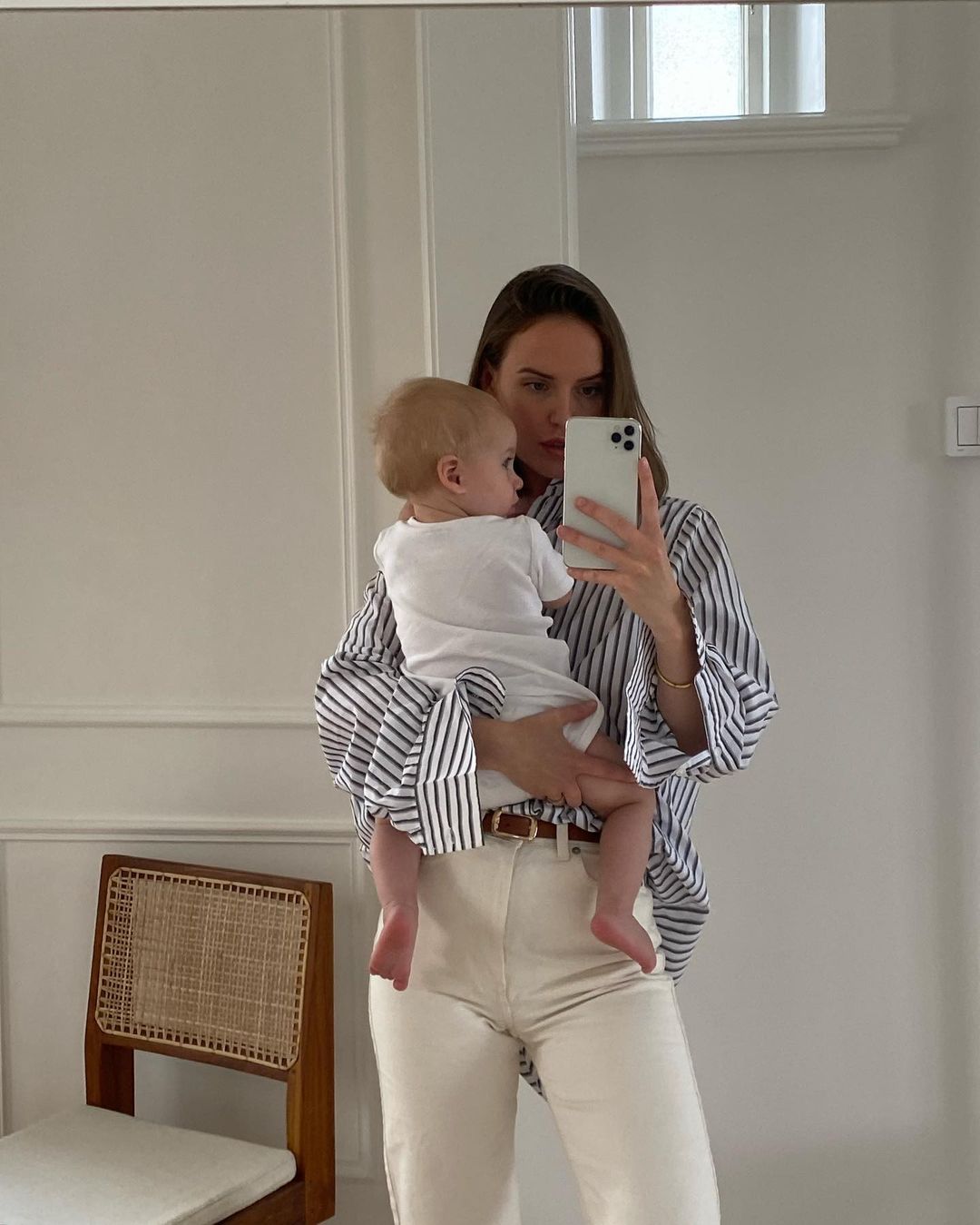 Cute and casual mom outfit with white jeans and striped shirt