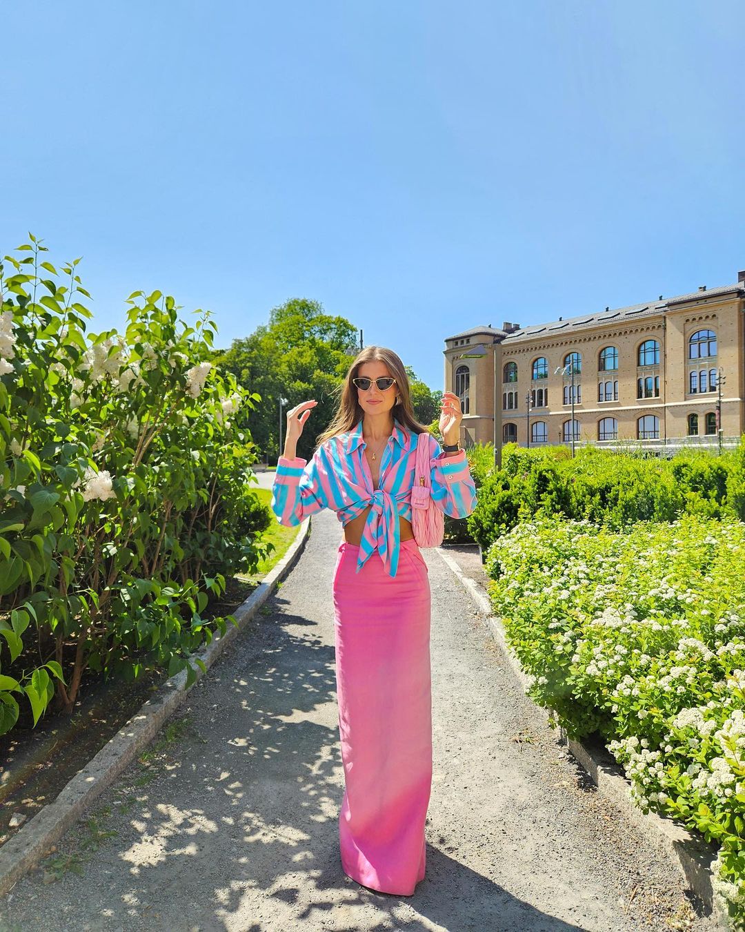 Colorful summer outfit with pink maxi skirt