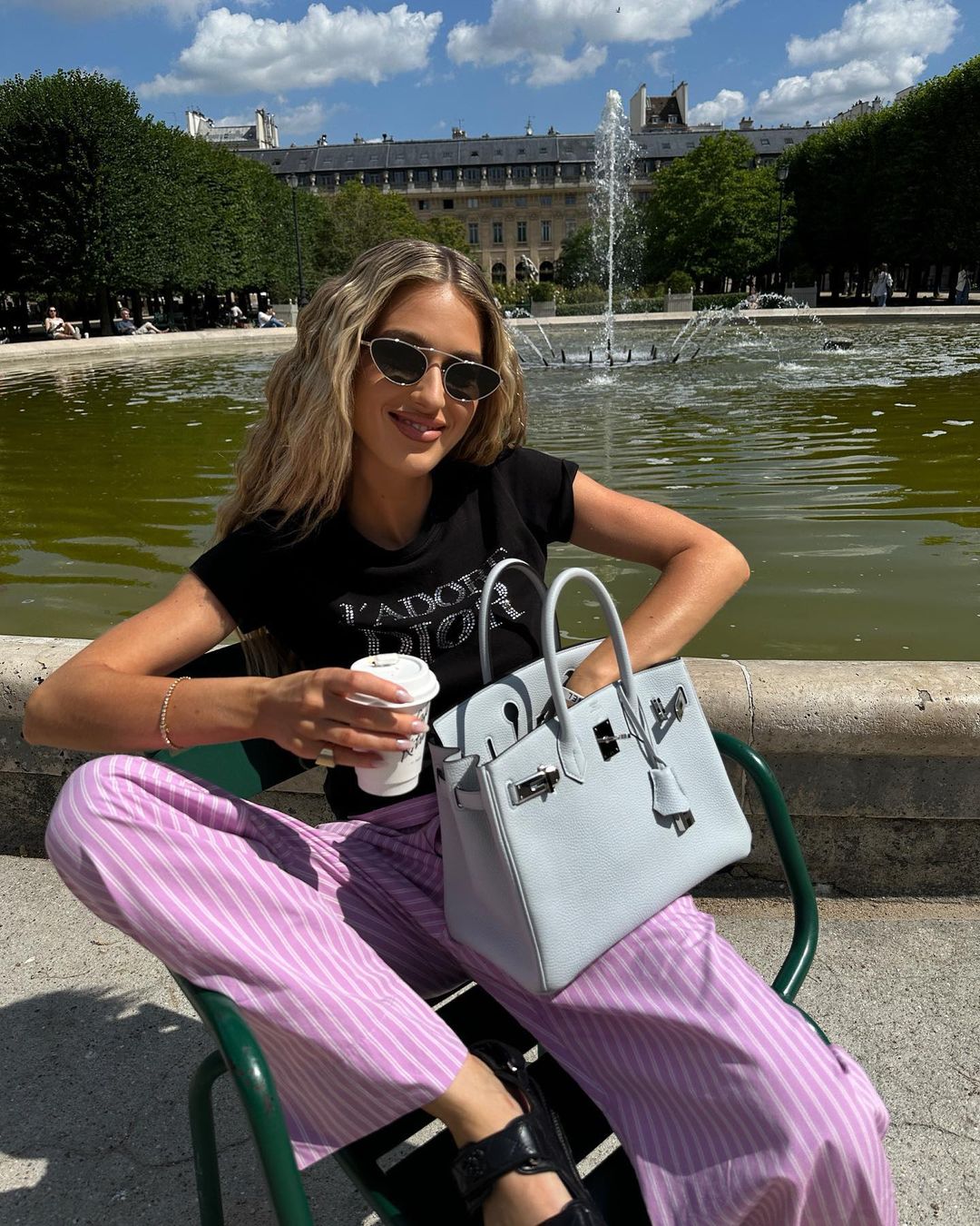 Stylish summer outfit with pink striped pants and grey Birkin bag