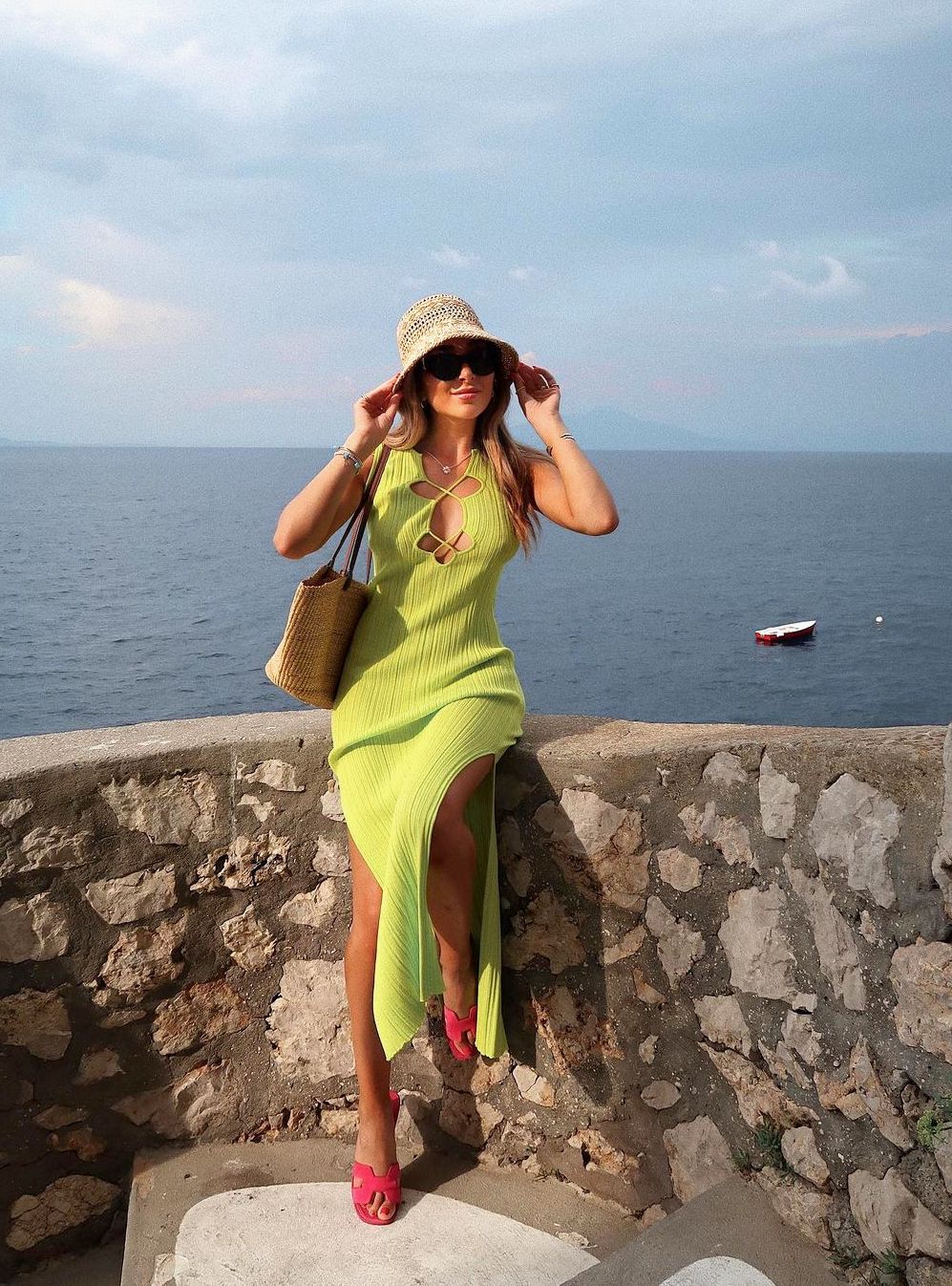 Chic South of France outfit with green dress and hot pink Hermes Oran sandals