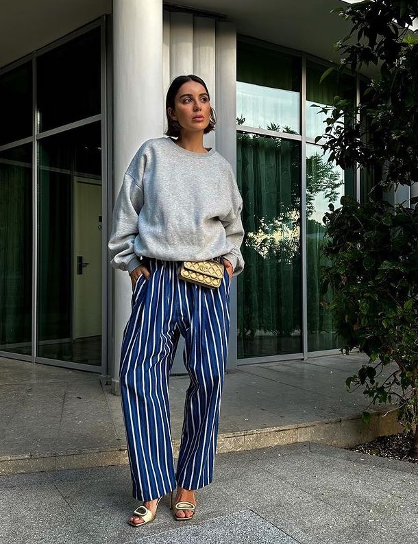 Chic dark blue striped pants outfit with grey sweatshirt