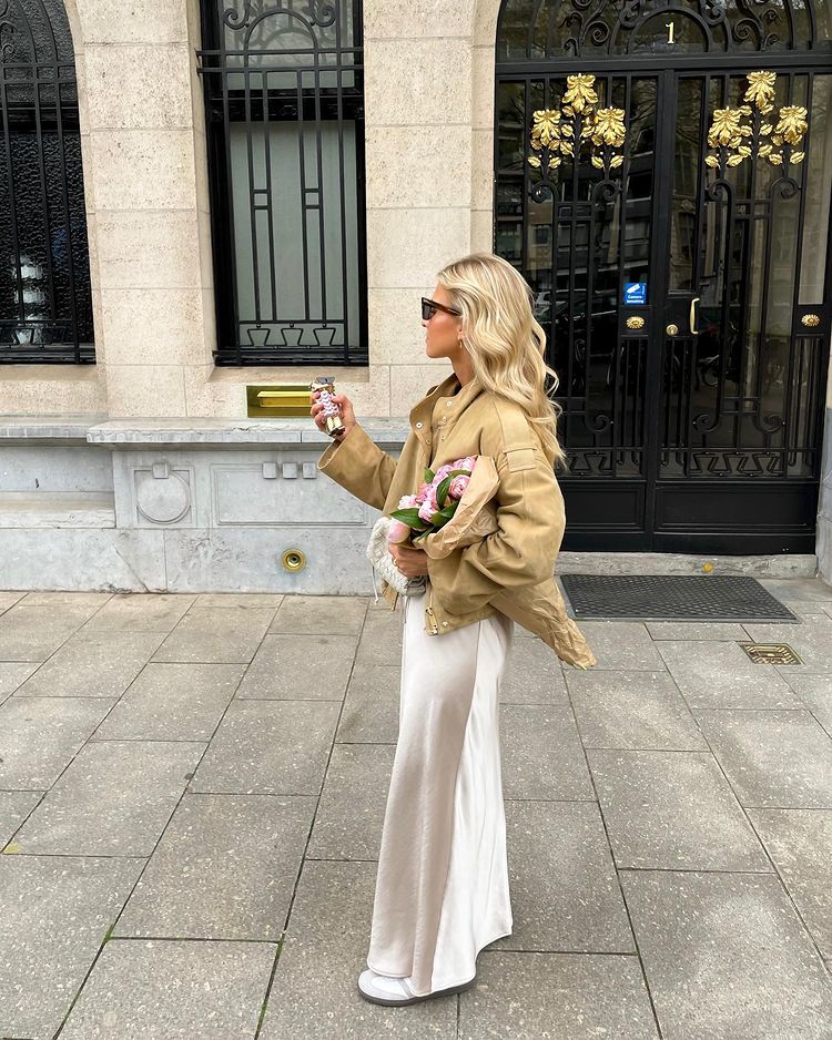 Chic champagne satin skirt outfit with camel suede jacket