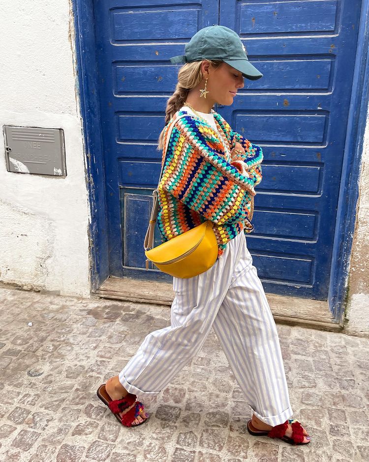 Colorful striped pants outfit with rainbow sweater