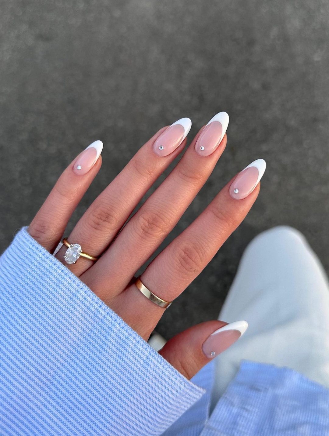 White French tip nails with rhinestones