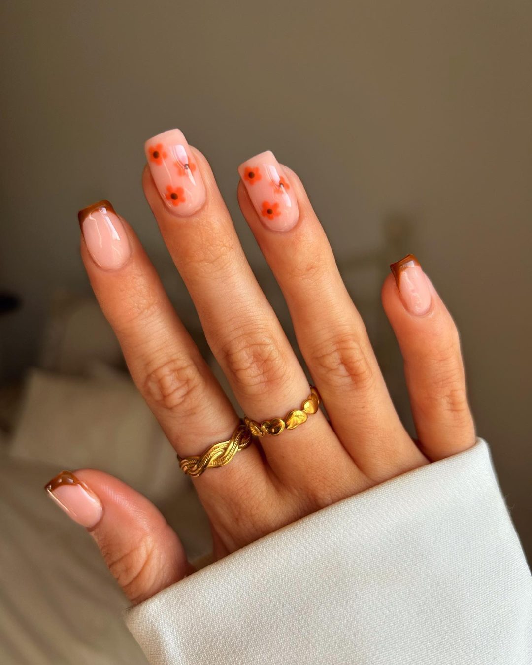 Minimalist fall French tip nails with flower nail art