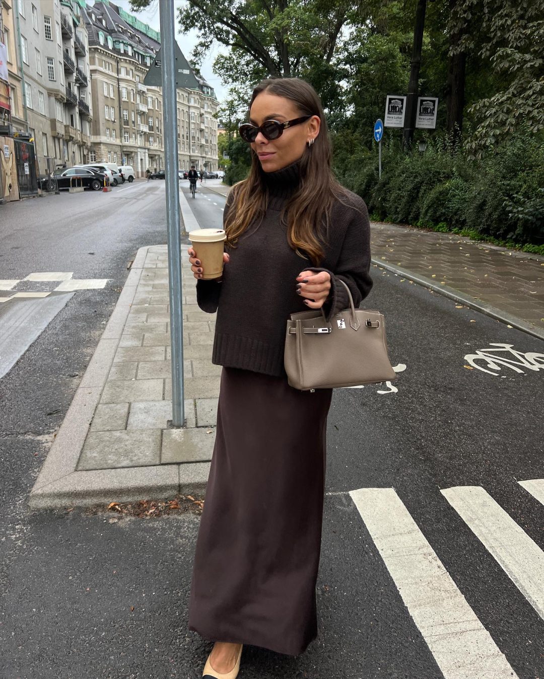 Brown Scandi style fall outfit with brown maxi skirt and sweater