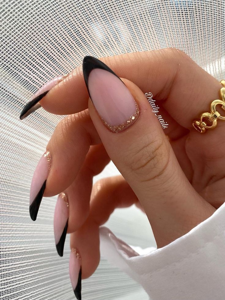 Black almond-shaped French tip nails