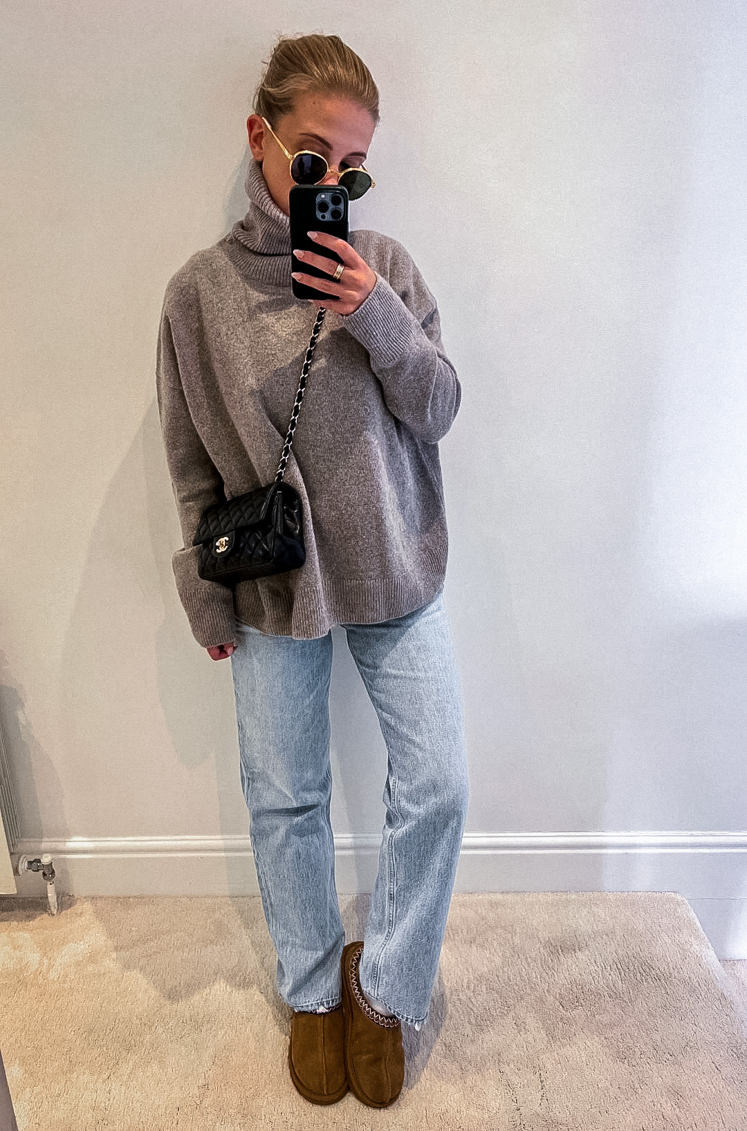 Casual Ugg tasman slipper outfit with grey sweater and straight-leg jeans