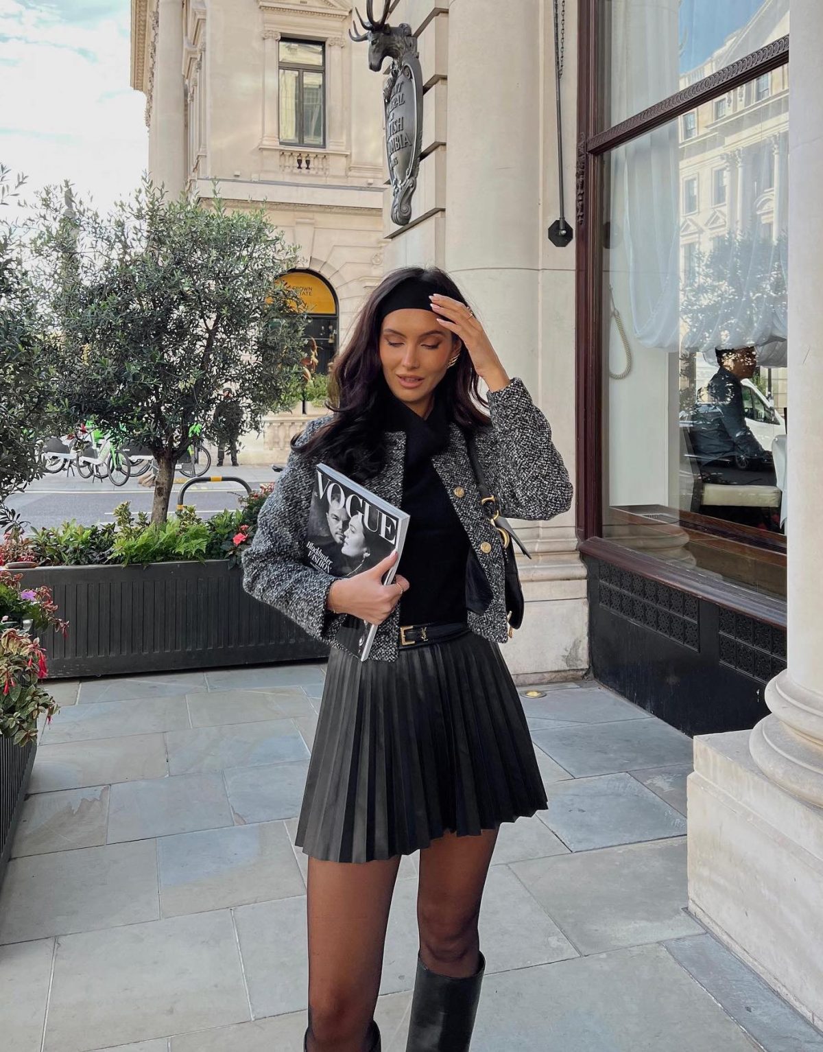 Preppy fall outfit with headband, structured cardigan and black pleated mini skirt.