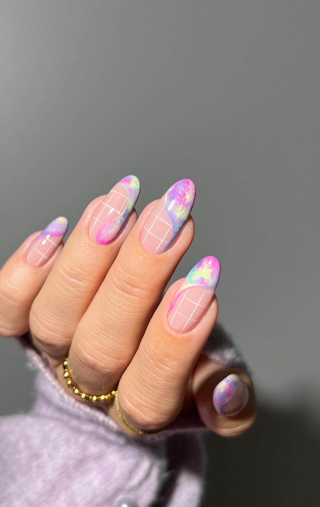 Pastel rainbow nails with French tips.