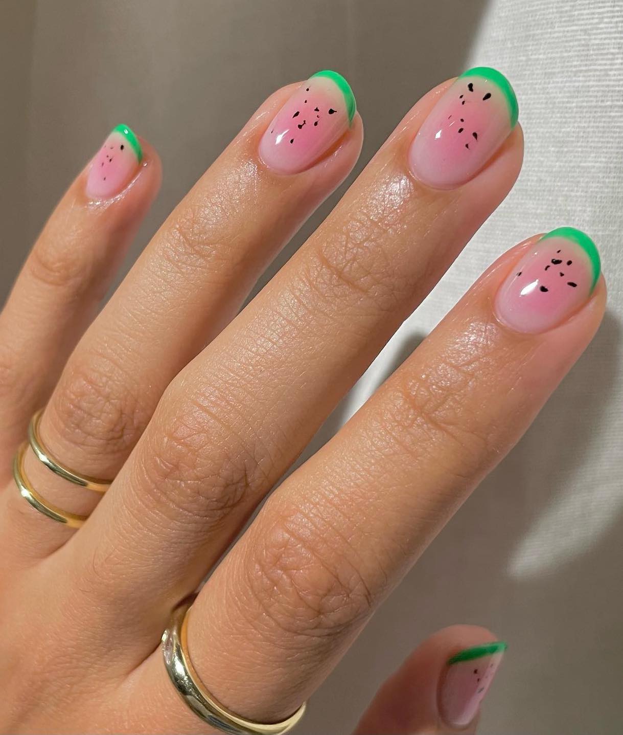 Short pink watermelon nails.