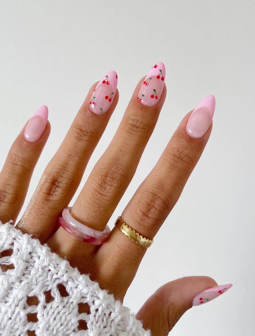 Light pink cherry nails with French tips.