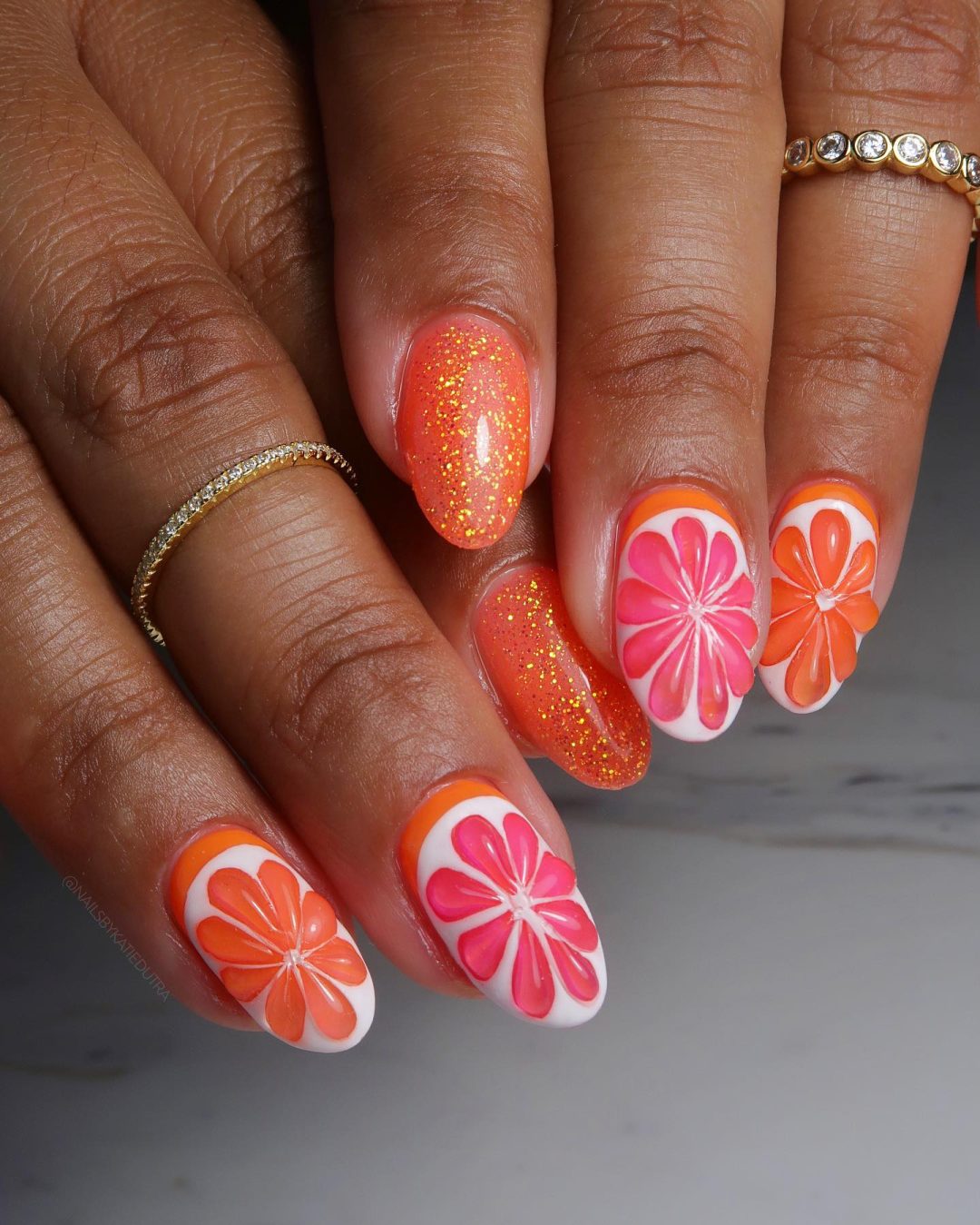Pink and orange fruit nails for summer.